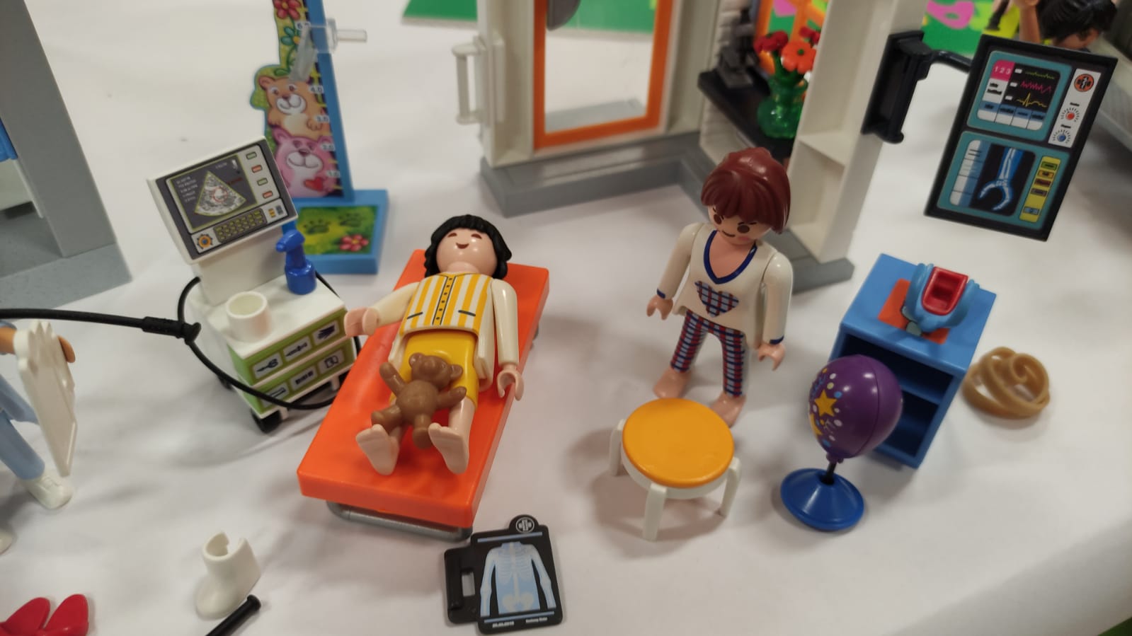 Photo of a toy patient in hospital, used for play sessions with children being treated for cancer. At these sessions, play specialists talk to the children about the children’s cancer centre consultation, and hear their views.