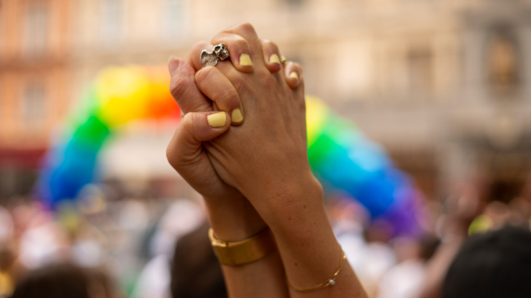 Two people holding hands